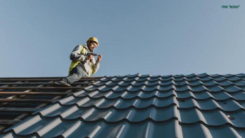 long-shot-man-working-roof-scaled